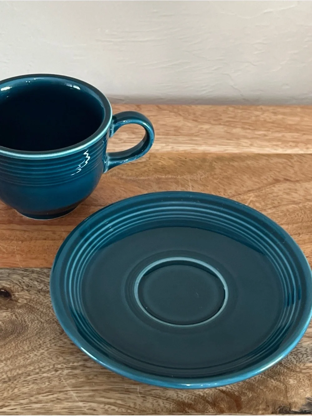 Fiesta tea cup and saucer set in the retired Juniper green color year stamp 2000
